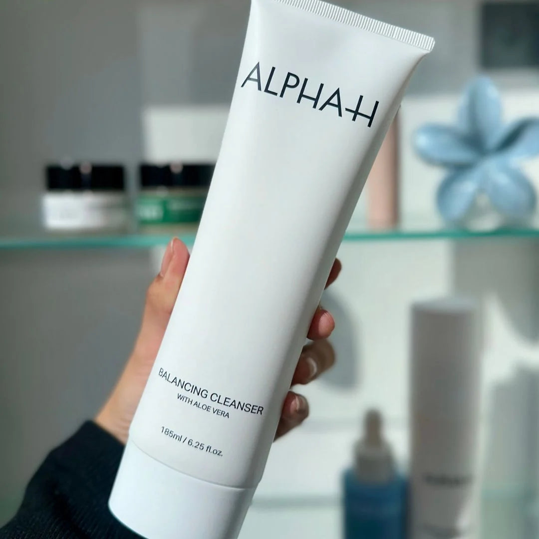 Alpha-H Clear Start First Routine – lifestyle shot: kit styled in a fresh, approachable bathroom setting