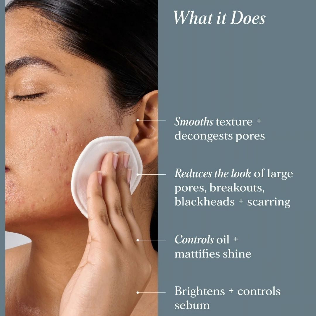Woman applying Alpha-H Clear Skin Tonic with a cotton pad to help smooth skin texture, decongest pores, control excess oil and reduce the look of breakouts