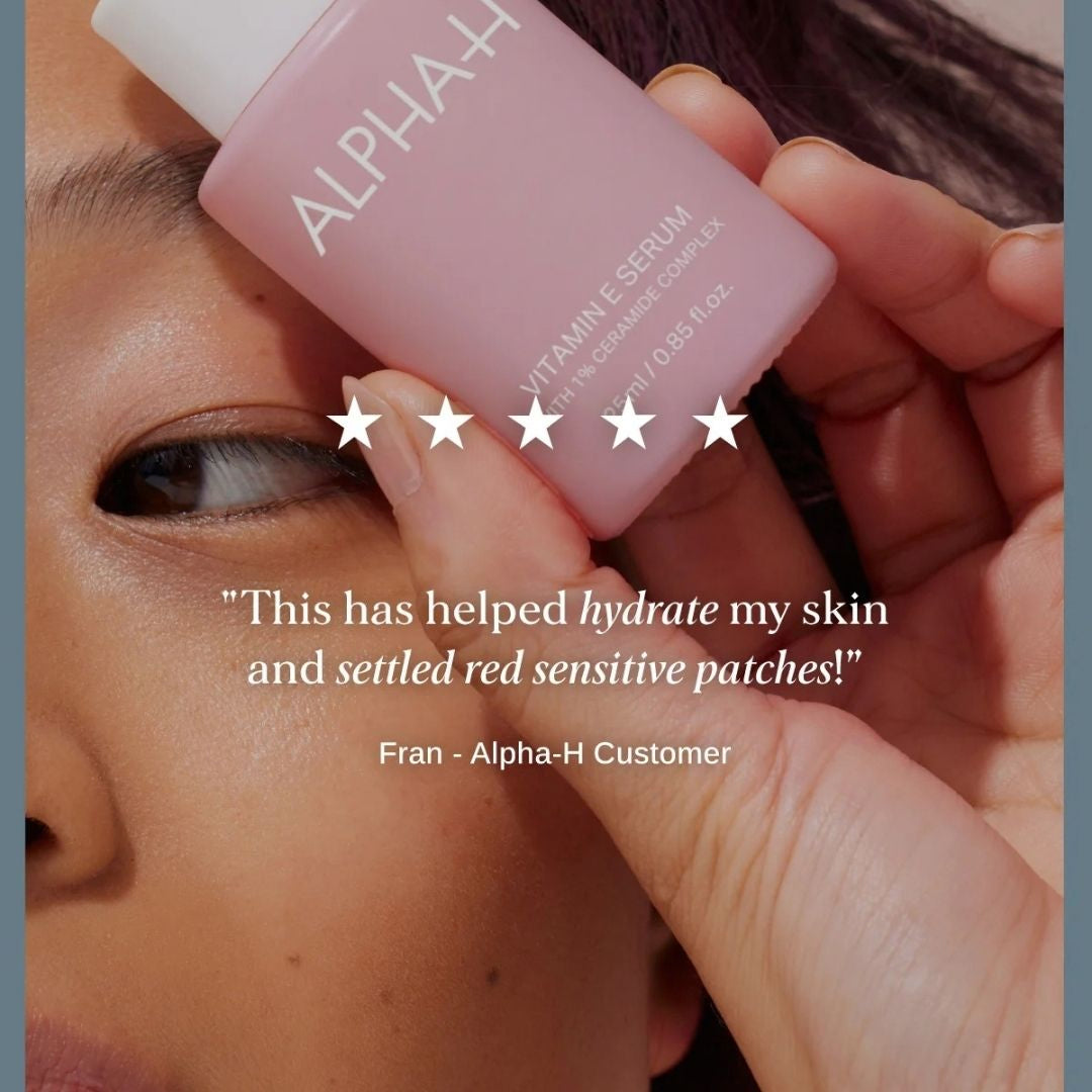 Alpha-H Vitamin E Serum held against the face with five-star customer review for hydrating dry, sensitive skin