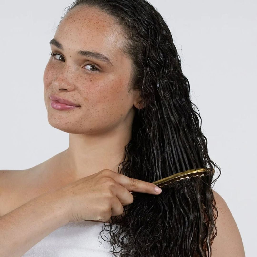 Deeper Love strengthening hair mask smoothed through wet lengths after shampooing