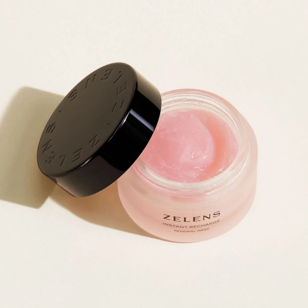 Zelens Instant Recharge Renewal Mask 50ml – lifestyle shot: model applying pink gel mask to cheek