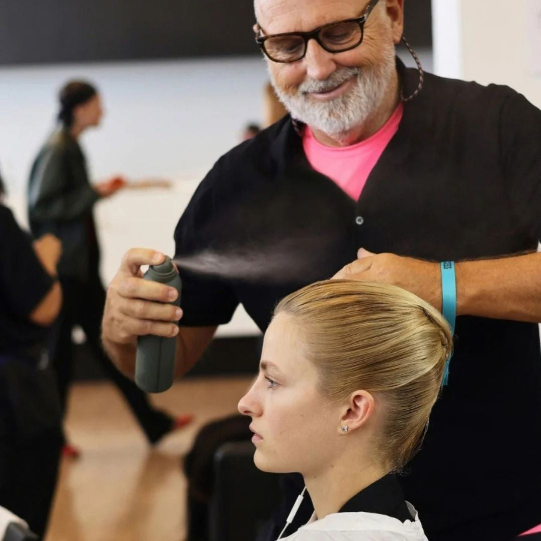 Hair by Sam McKnight Modern Hairspray misted over hair backstage to set a finished style