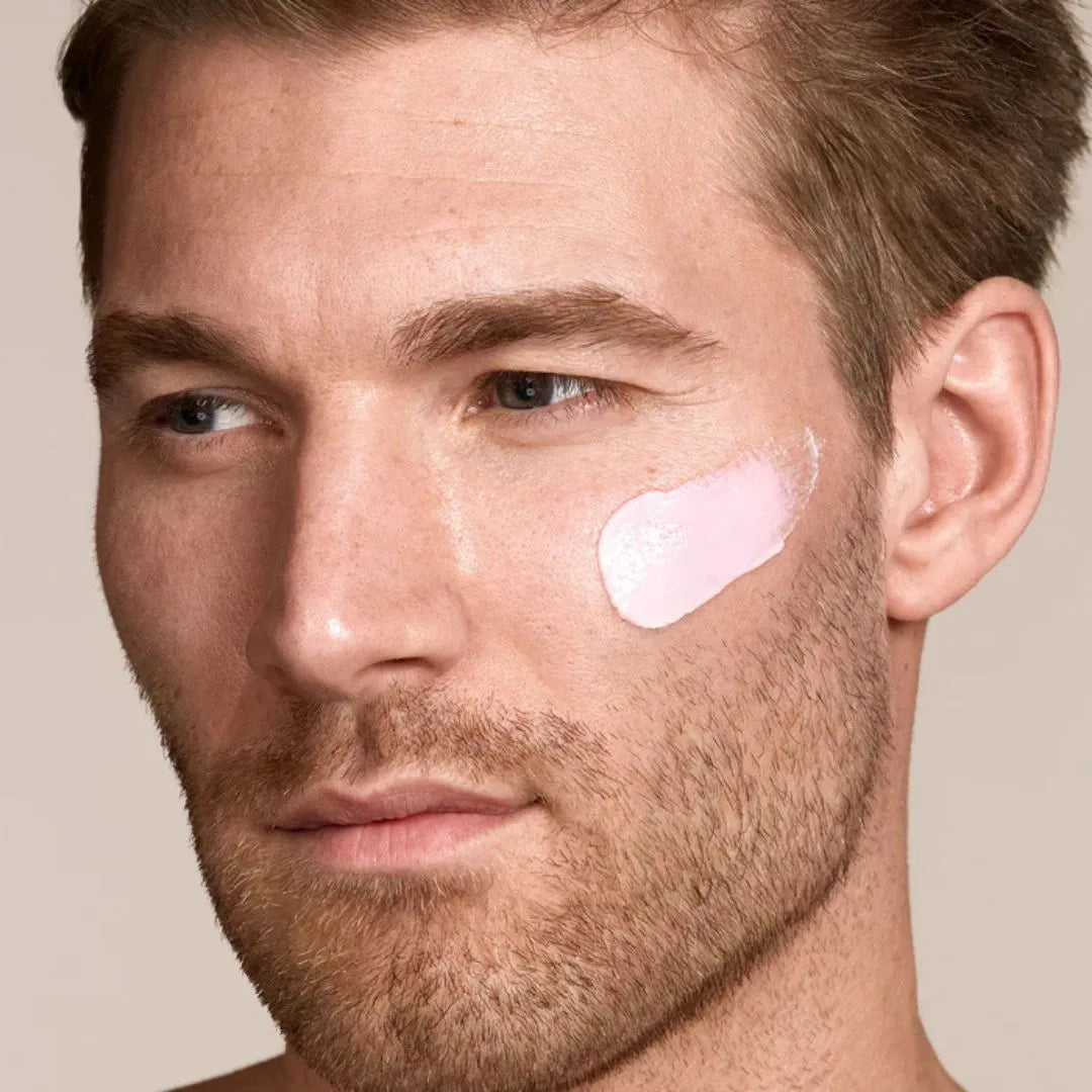 Zelens Daily Defence SPF 50 applied to the cheek, showing the silky fluid with no white cast