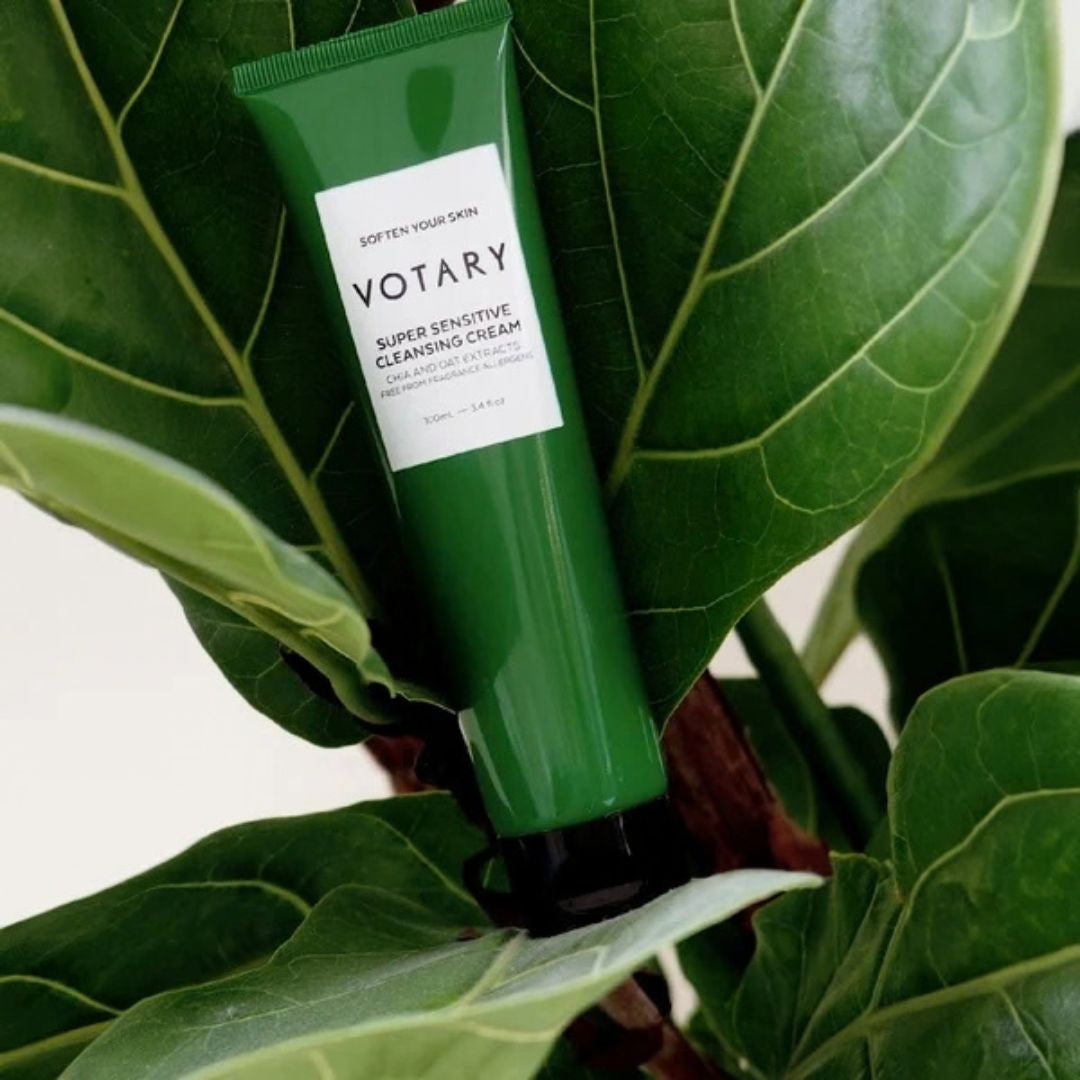 Votary Super Sensitive Cleansing Cream with Chia and Oat Extract displayed against green leaves