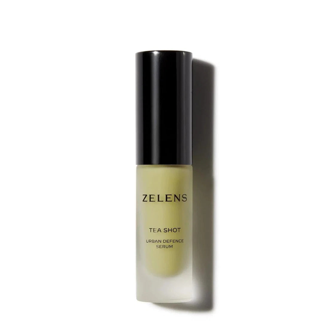Zelens Tea Shot Urban Defence Serum in a frosted glass bottle with a black cap, shown on a white background with a soft shadow.