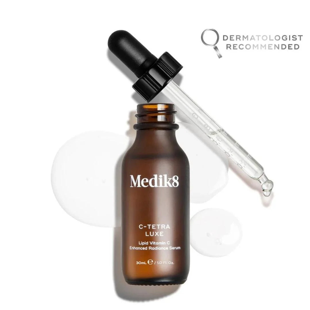 Medik8 C Tetra Luxe 14% Vitamin C Enhanced Radiance Serum 30ml – serum texture dropper close-up on white background
