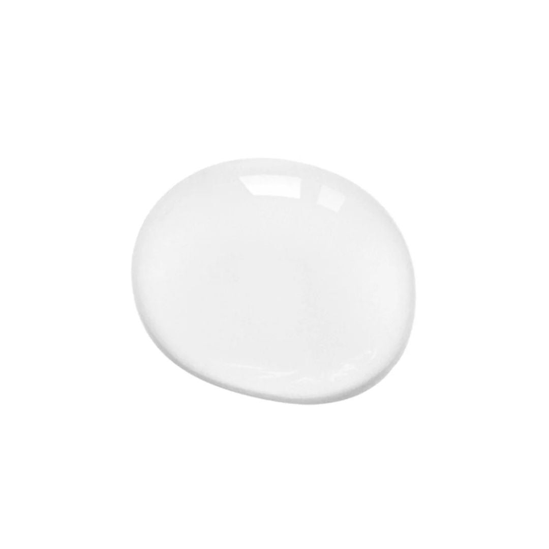 A smooth, glossy, oval-shaped white ceramic dish or coaster on a solid white background.
