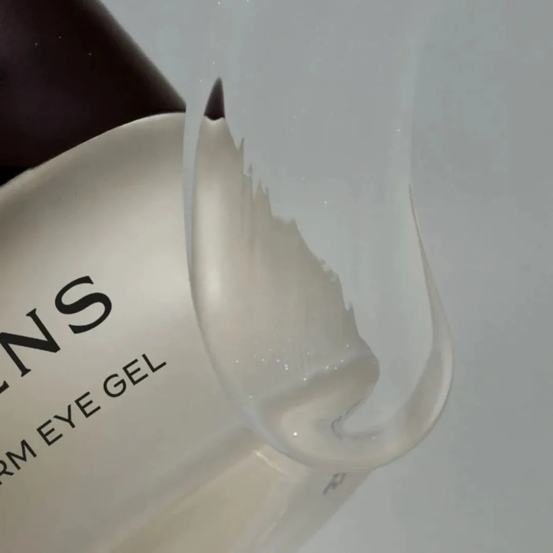 Eye gel container with a spoonful of gel on a white background
