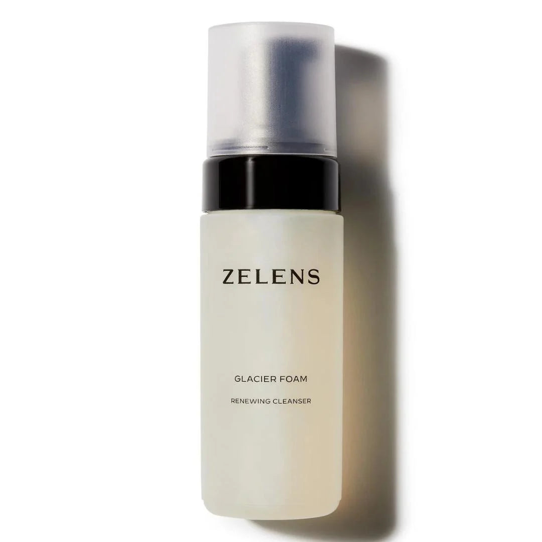 Zelens Glacier Foam Renewing Cleanser in a frosted glass bottle with a black collar and a clear cap, shown on a white background with a soft shadow.