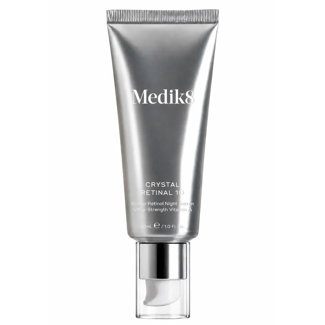 Medik8 Crystal Retinal 10 Retinol Night Cream in a metallic silver squeeze tube with a clear cap, shown on a solid white background.