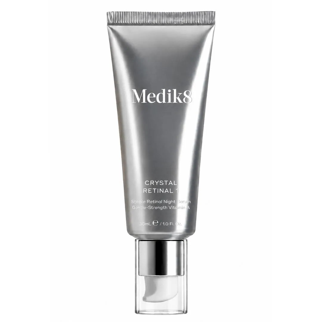 Medik8 Crystal Retinal 1 Retinol Night Cream in a metallic silver squeeze tube with a clear cap, shown on a solid white background.