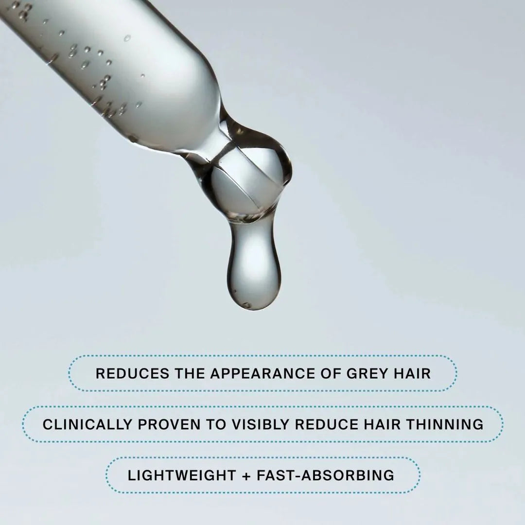 Syringe with liquid droplet on a light gray background, featuring text about hair care product benefits.