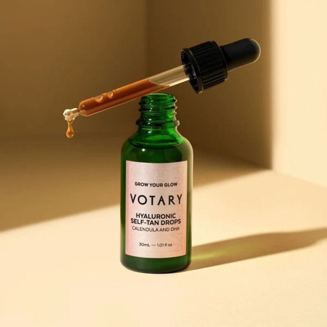 Votary Hyaluronic Self-Tan Drops bottle with dropper showing the lightweight tanning serum texture