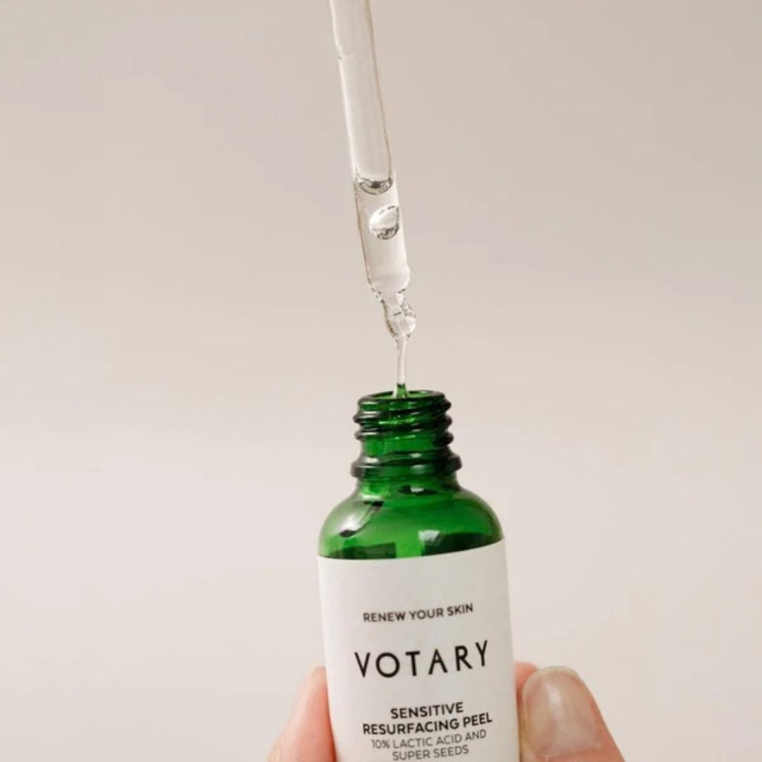 Votary Sensitive Resurfacing Peel 10% lactic acid facial exfoliant texture shown with glass dropper and green bottle