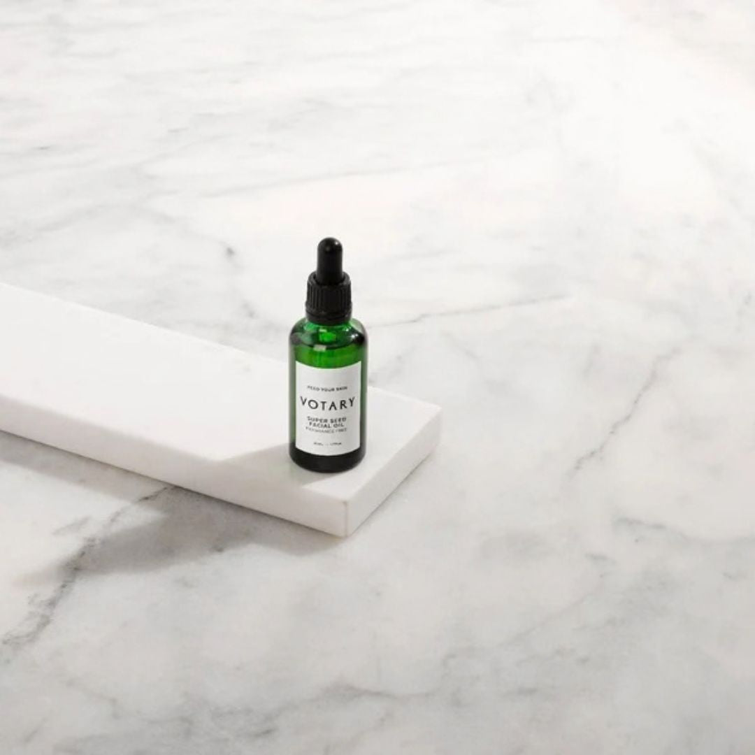 Votary Super Seed Facial Oil fragrance-free face oil bottle displayed on white marble