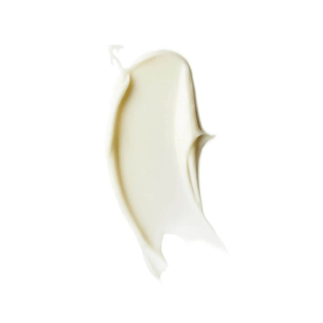 A thick, creamy swatch of off-white cosmetic cream or lotion, showing a smooth texture with soft shadows, isolated on a solid white background.