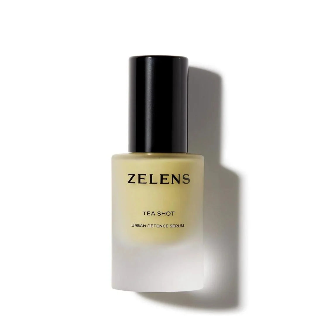 Zelens Tea-Shot Urban Defence Serum in a frosted glass bottle with a black cap, shown on a white background with a soft shadow.