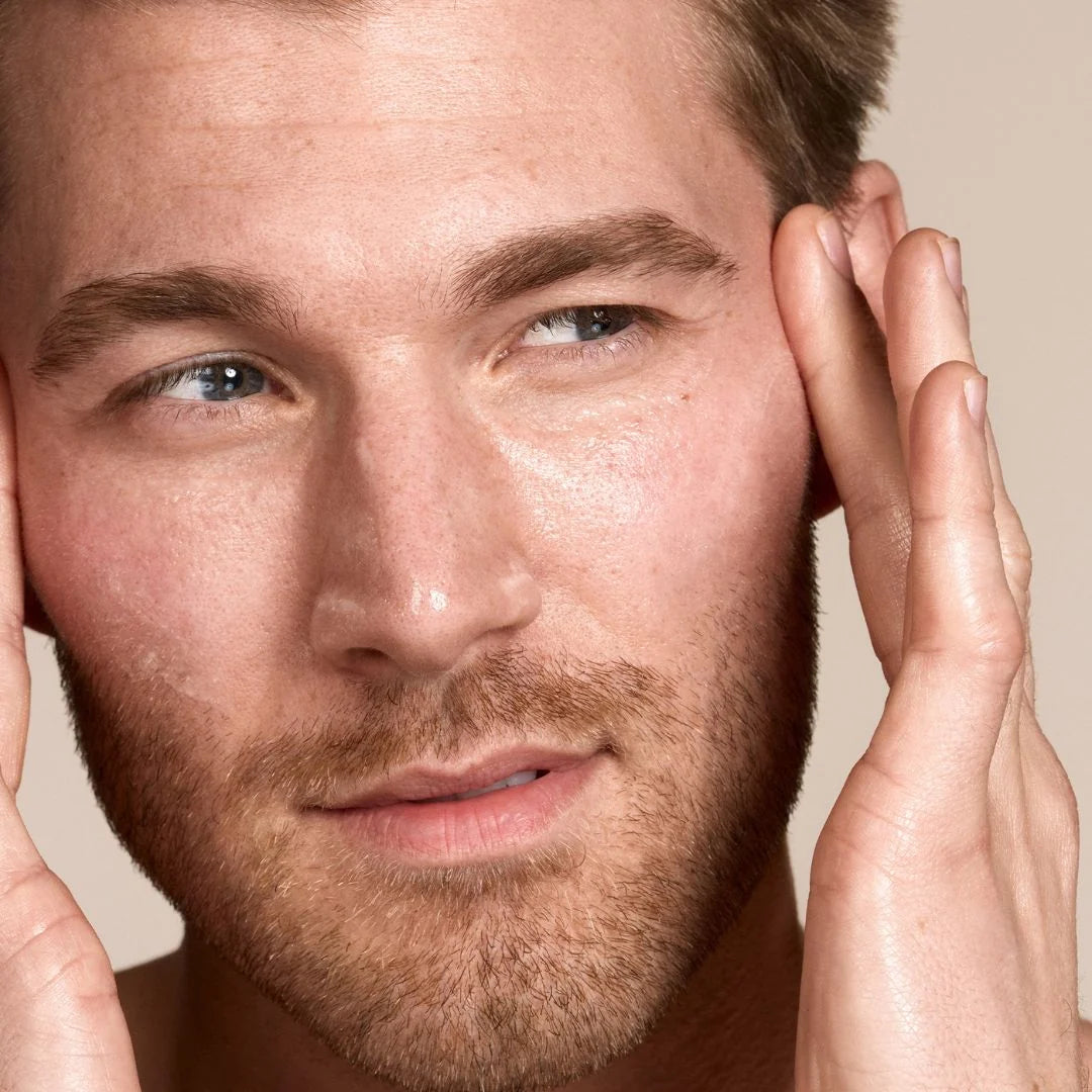 Zelens Hyaluron Intense Hydro-Plumping Serum 30ml – lifestyle shot: bearded model with hands on face against neutral background