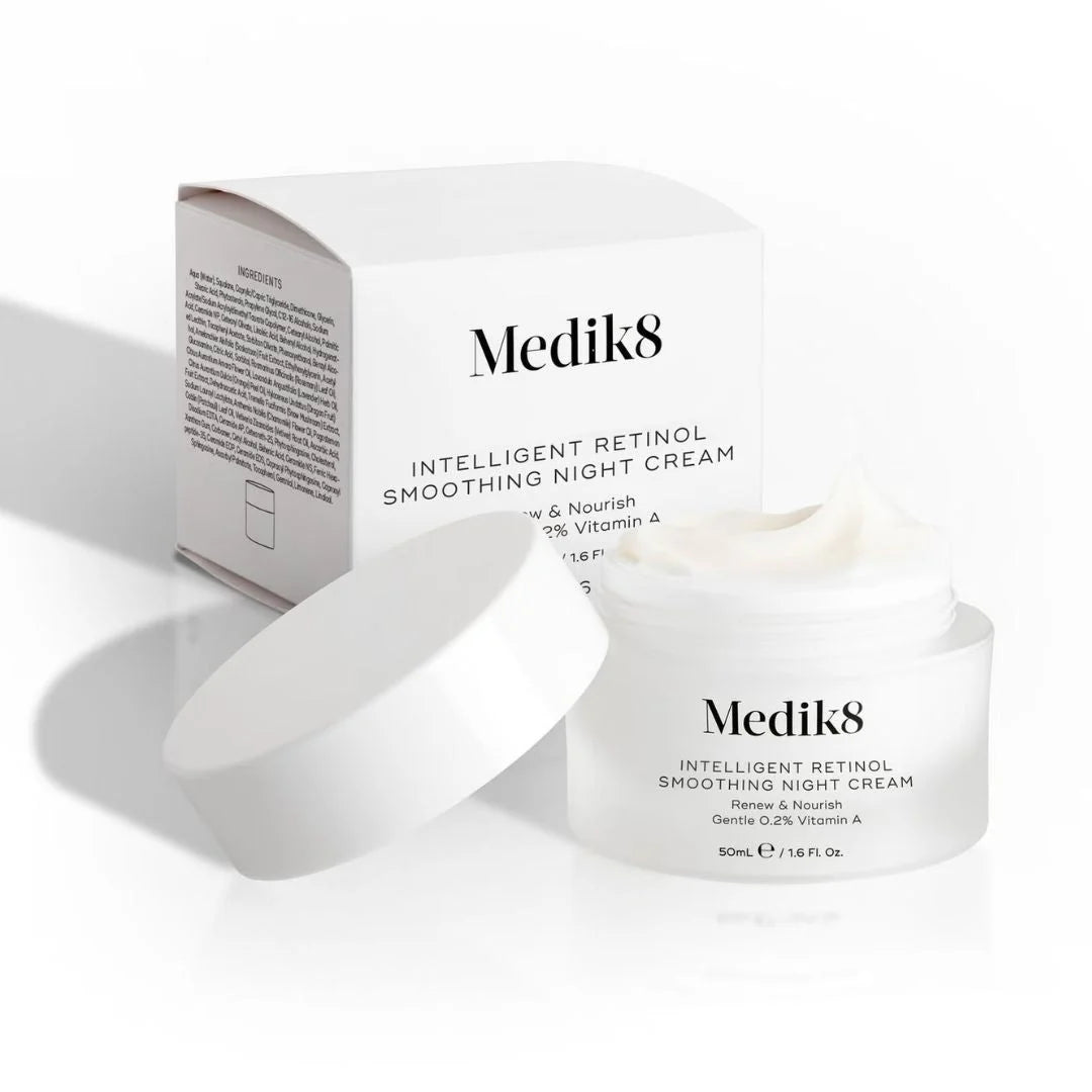 Medik8 Intelligent Retinol Smoothing Night Cream shown with its white product box, open white jar, and detached white lid on a clean white background.